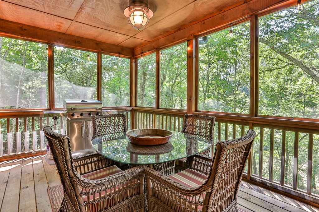 40 Graham Court Ellijay, GA 30540 - Photo 18 of 62 a view of a two chairs and table in the balcony
