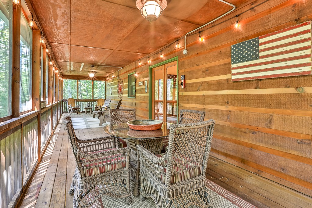 40 Graham Court Ellijay, GA 30540 - Photo 20 of 62 a balcony with chairs and outdoor view