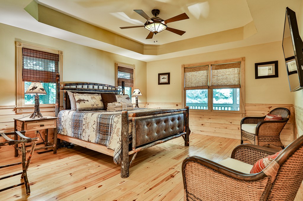 40 Graham Court Ellijay, GA 30540 - Photo 22 of 62 a bedroom with furniture and wooden floor