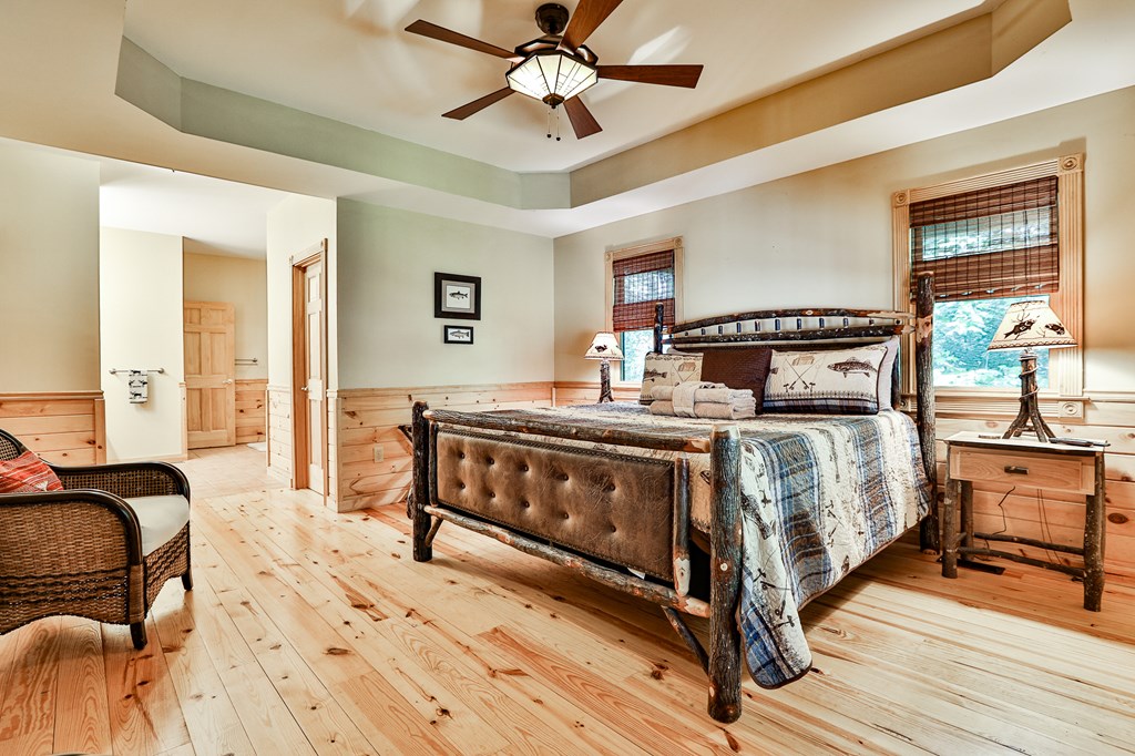 40 Graham Court Ellijay, GA 30540 - Photo 23 of 62 a bedroom with a bed and wooden floor