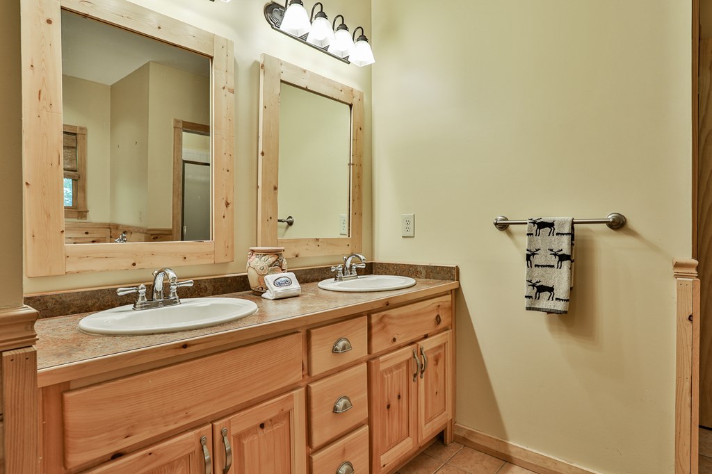 40 Graham Court Ellijay, GA 30540 - Photo 24 of 62 a bathroom with a sink and mirror