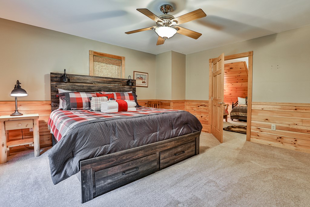 40 Graham Court Ellijay, GA 30540 - Photo 28 of 62 a bedroom with a bed and ceiling fan