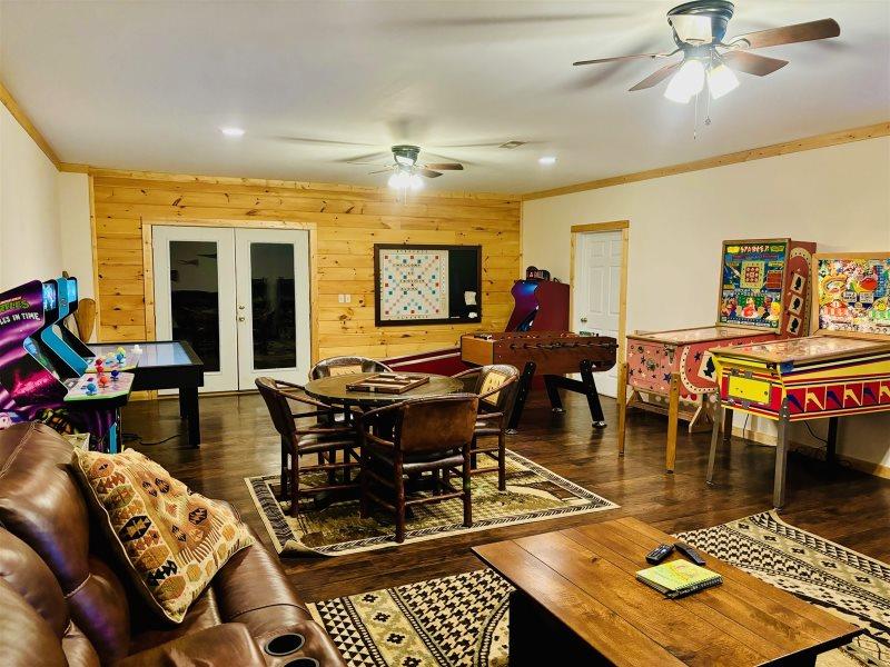40 Graham Court Ellijay, GA 30540 - Photo 61 of 62 a living room filled with furniture a rug and a chandelier