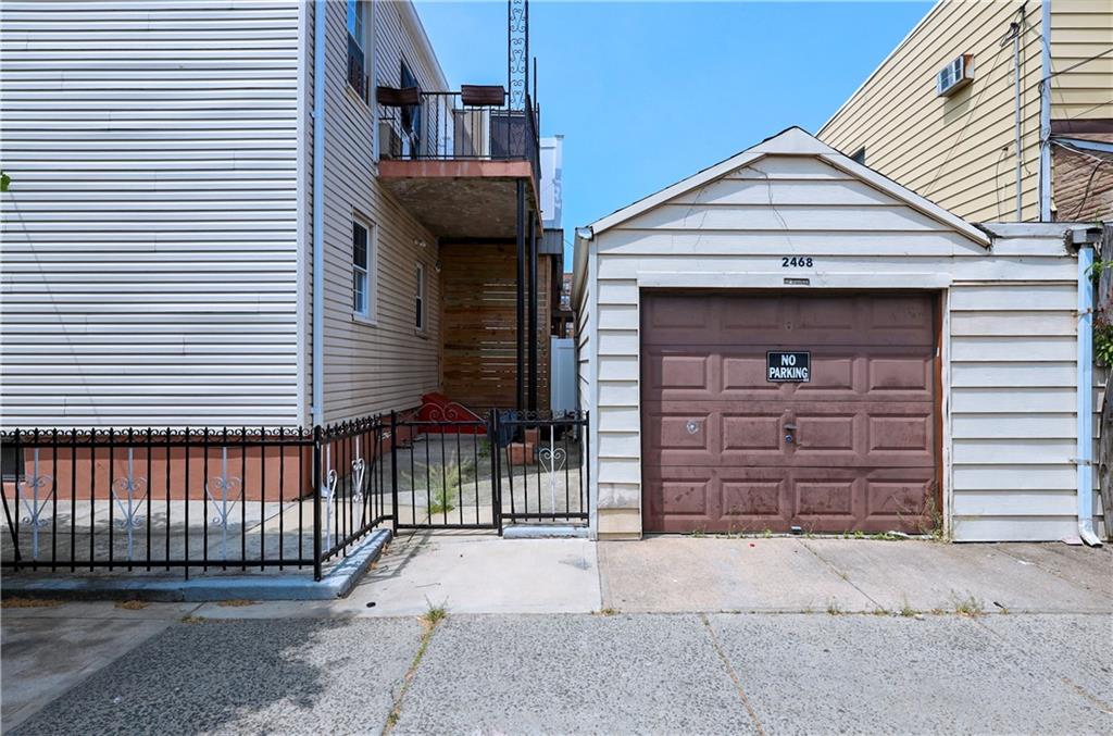 1323 Ave Y Brooklyn, NY 11235 - Photo 2 of 2 a front view of a house with a garage