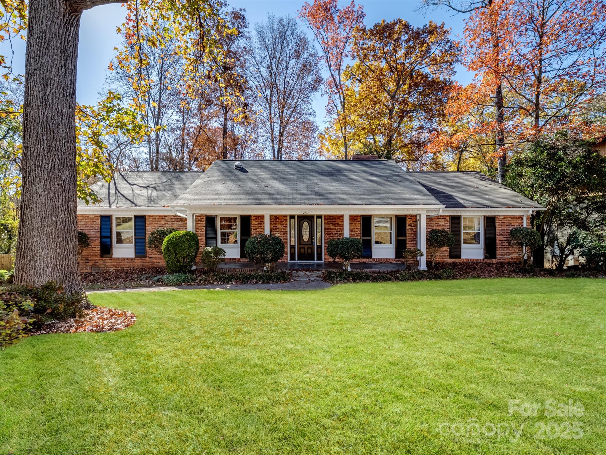 2111 Sagamore Road Charlotte, NC 28209 - Photo 1 of 48 a view of a house with a yard and sitting area