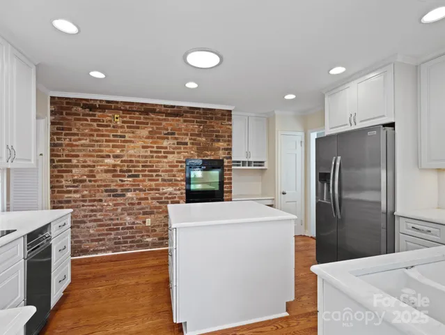 a stove top oven sitting inside of a kitchen