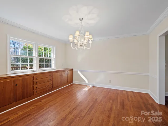 a view of kitchen with window and wooden floor