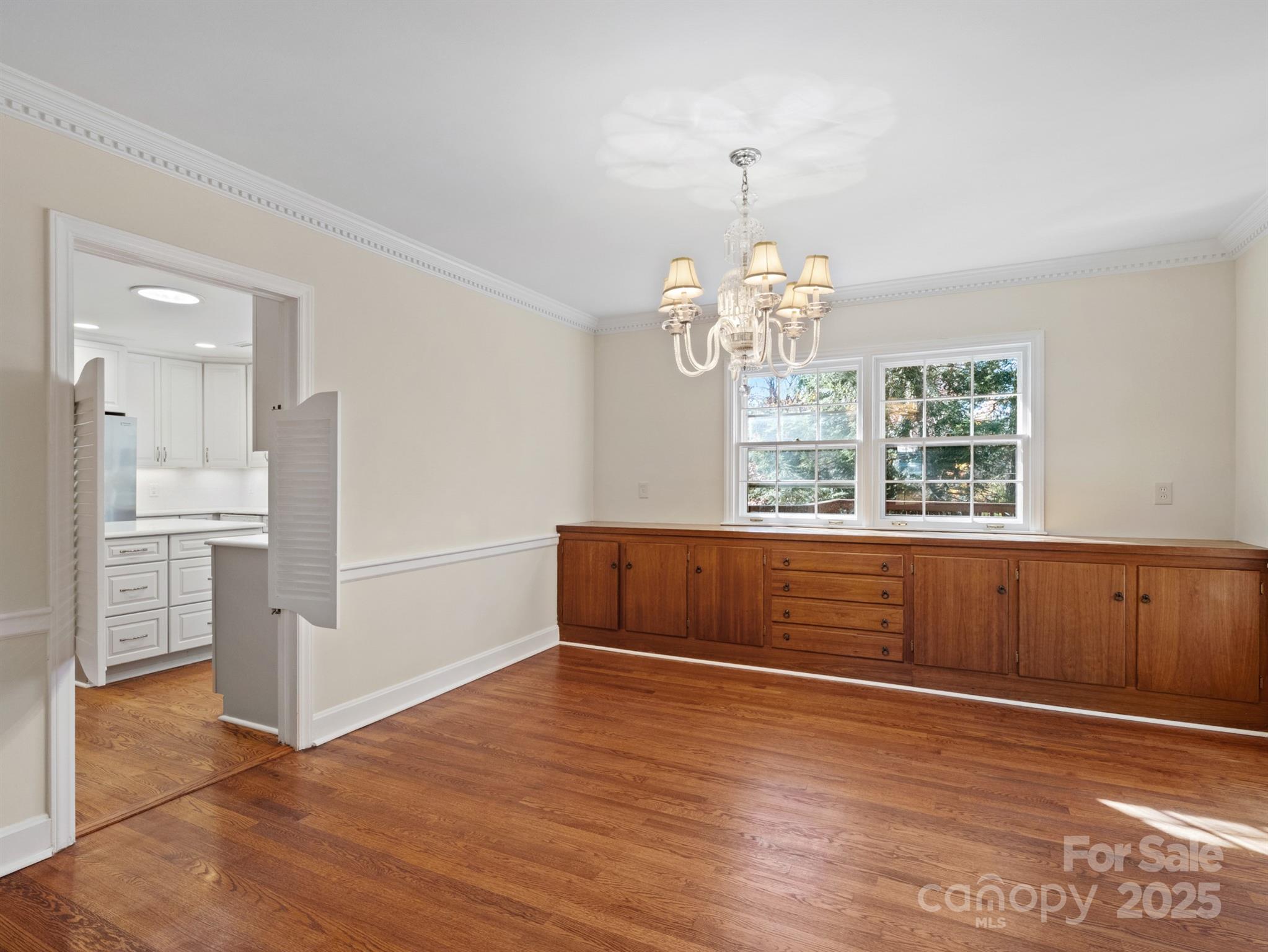 2111 Sagamore Road Charlotte, NC 28209 - Photo 19 of 48 a view of kitchen with window and wooden floor