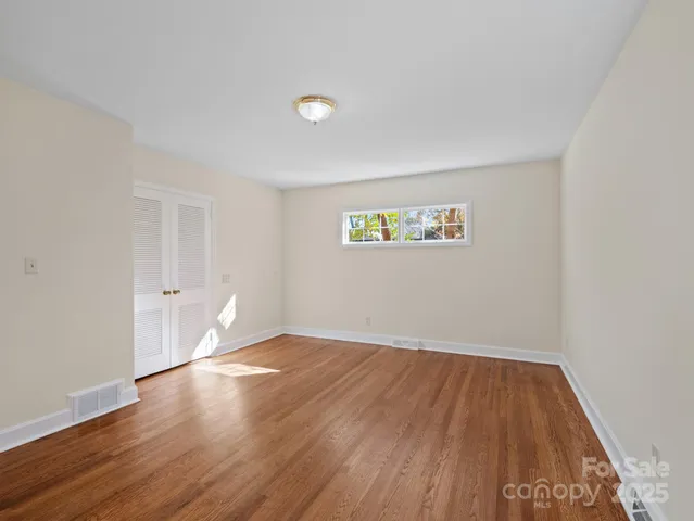 a view of wooden floor in an empty room