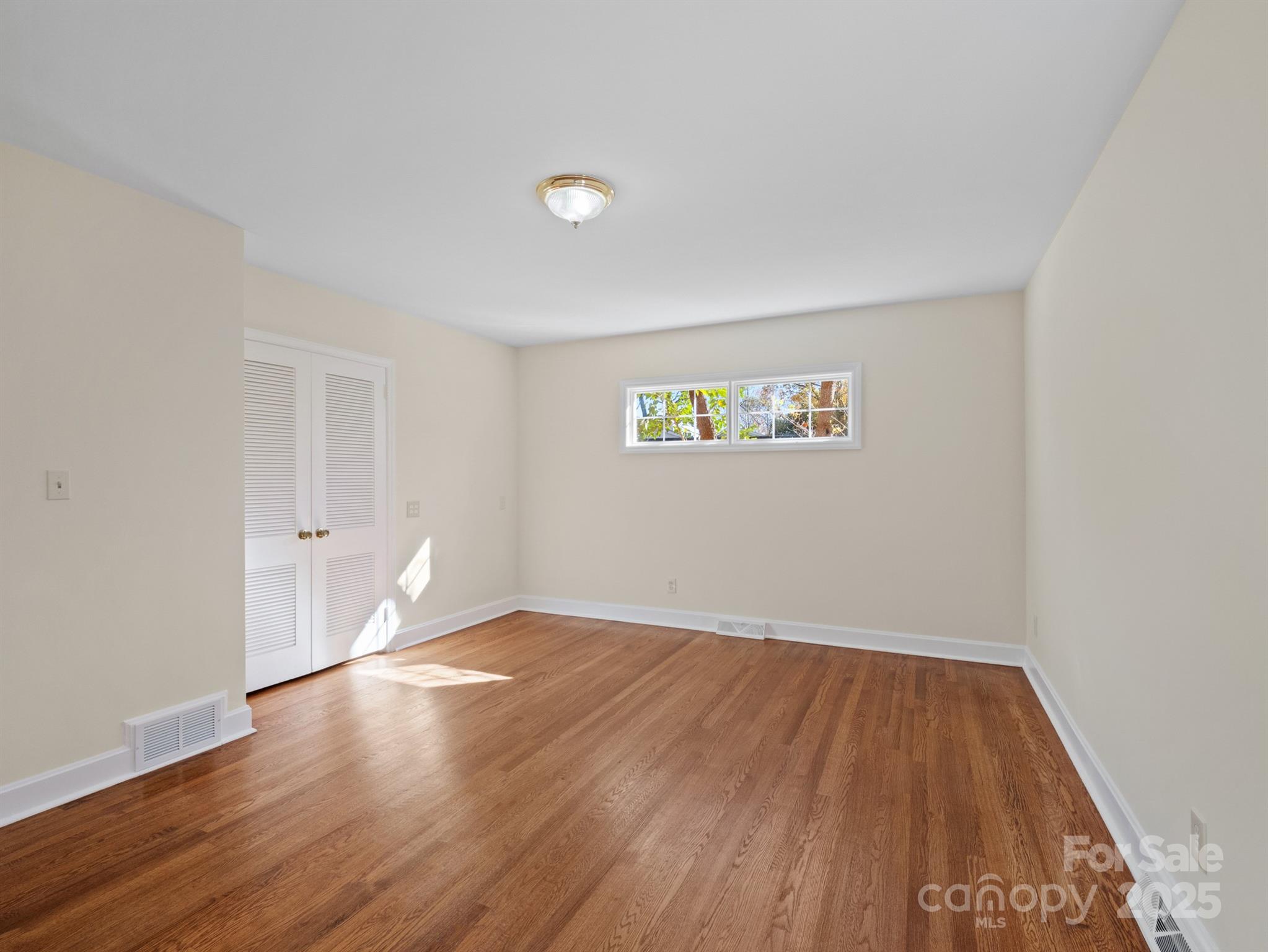2111 Sagamore Road Charlotte, NC 28209 - Photo 21 of 48 a view of an empty room with wooden floor