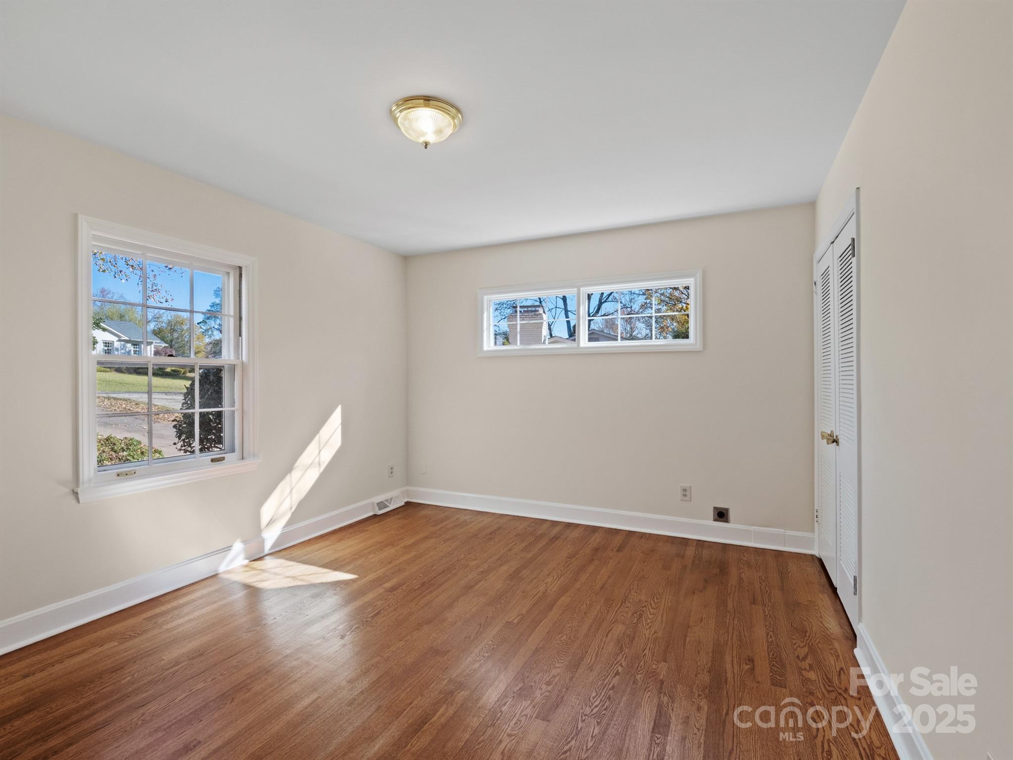 2111 Sagamore Road Charlotte, NC 28209 - Photo 26 of 48 a view of a room with wooden floor and a window