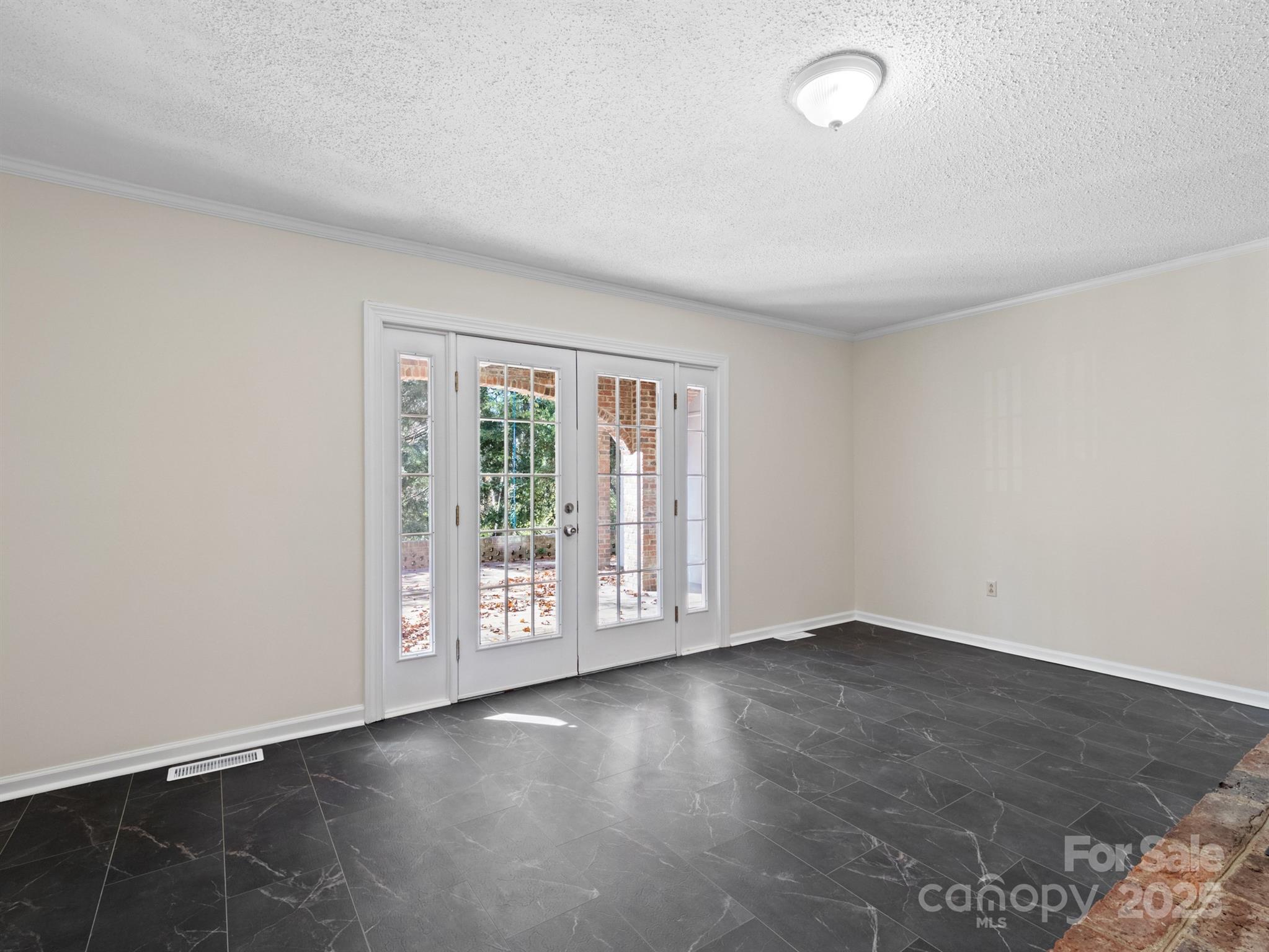 2111 Sagamore Road Charlotte, NC 28209 - Photo 31 of 48 an empty room with wooden floor and windows
