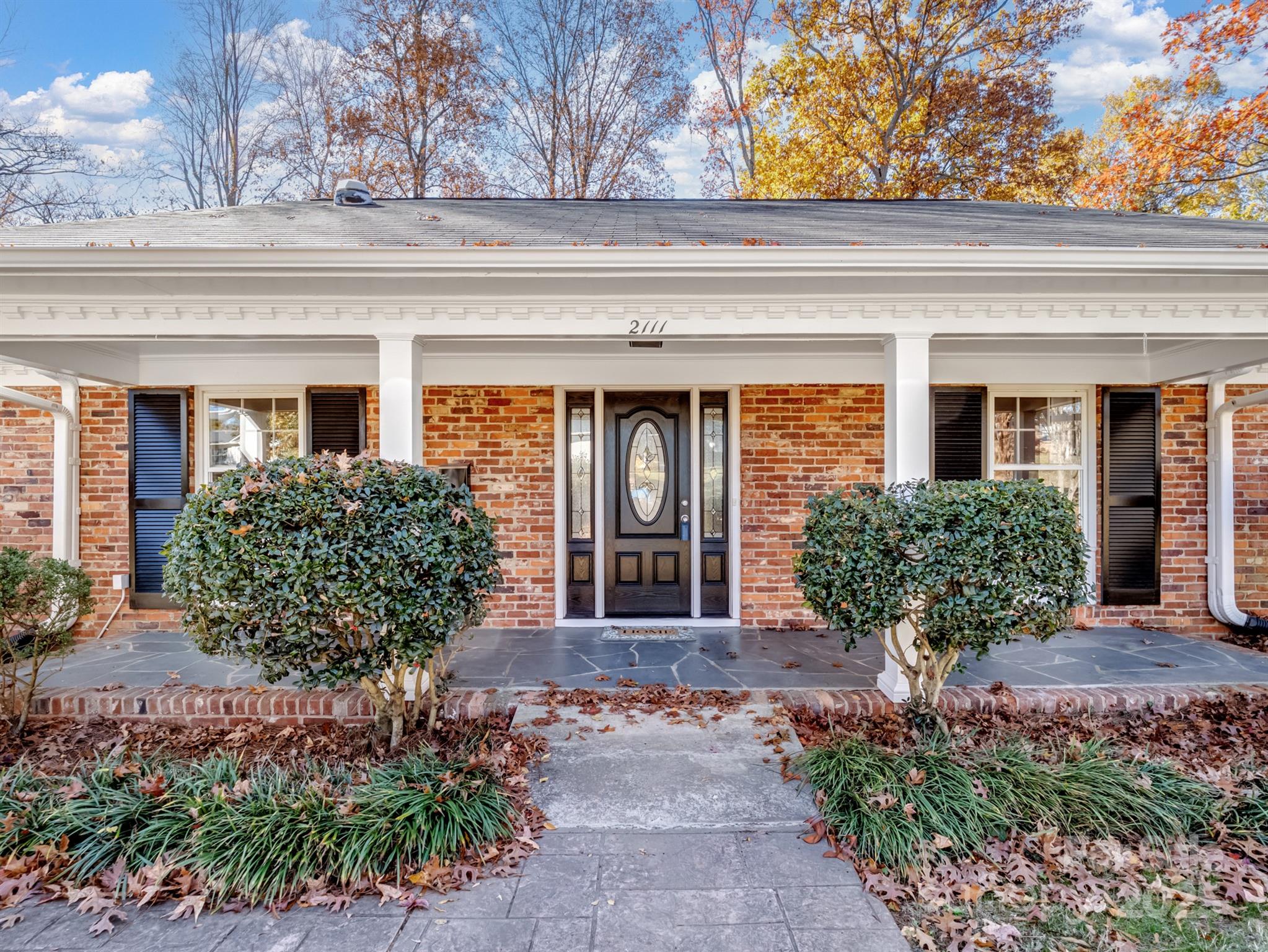 2111 Sagamore Road Charlotte, NC 28209 - Photo 39 of 48 front view of a house with potted plants
