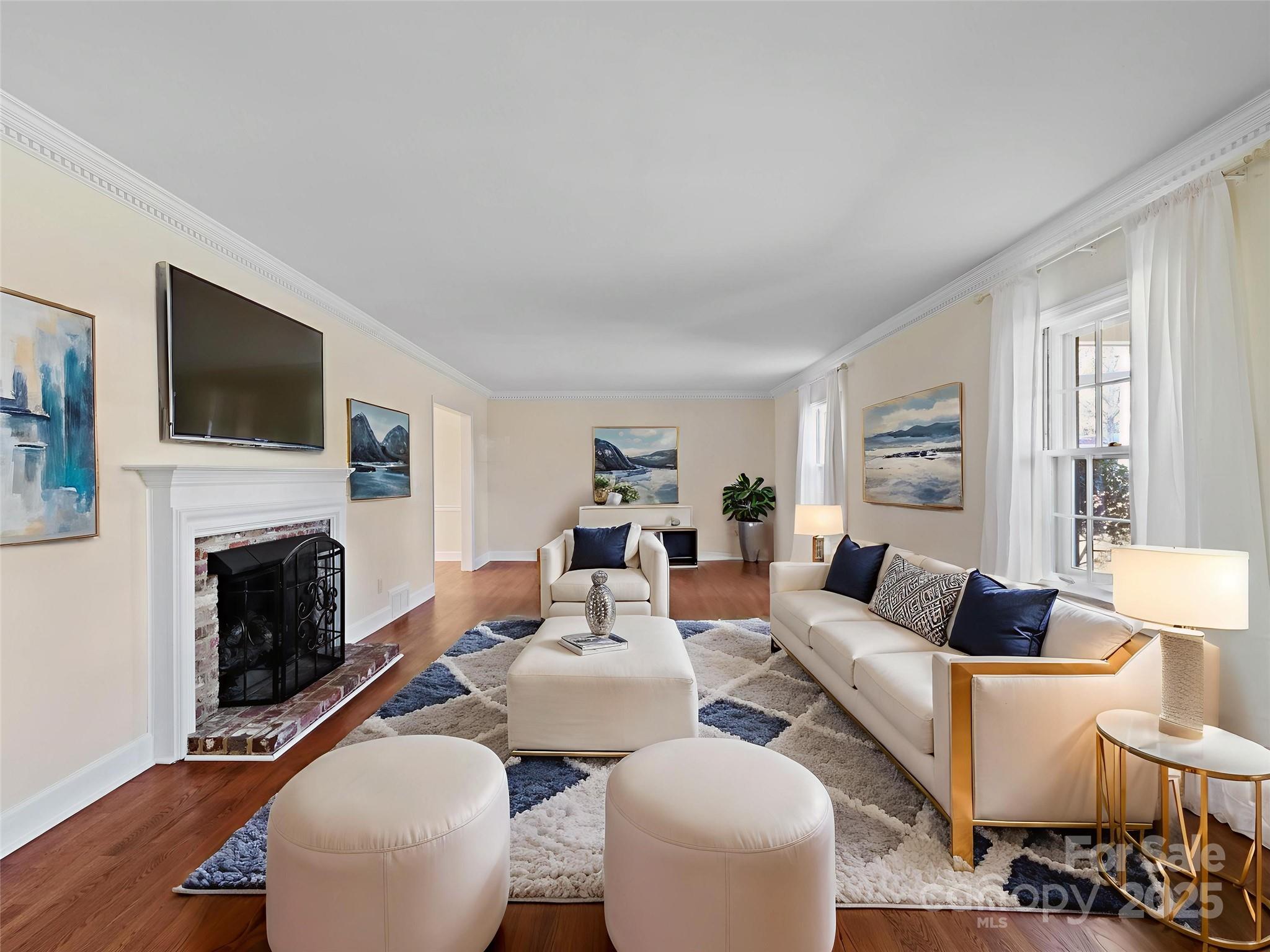 2111 Sagamore Road Charlotte, NC 28209 - Photo 4 of 48 a living room with furniture a fireplace and a flat screen tv