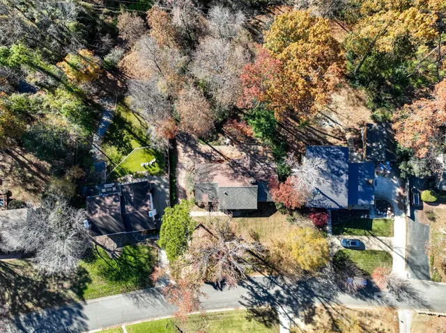 an aerial view of residential houses with outdoor space
