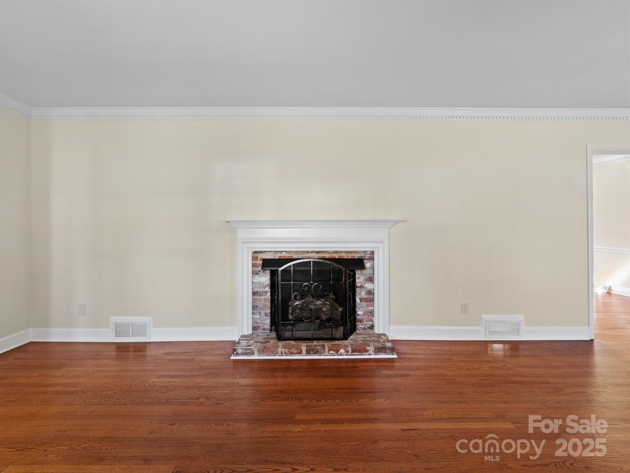 2111 Sagamore Road Charlotte, NC 28209 - Photo 9 of 48 a view of a livingroom with wooden floor and a fireplace