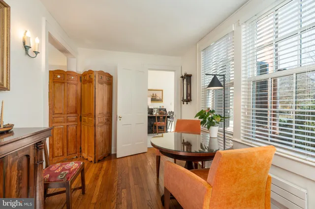 a living room with furniture and large windows