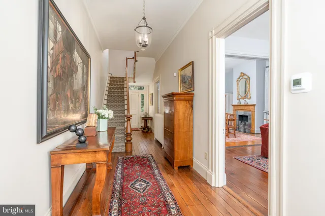 a very nice looking room with a large window and wooden floor