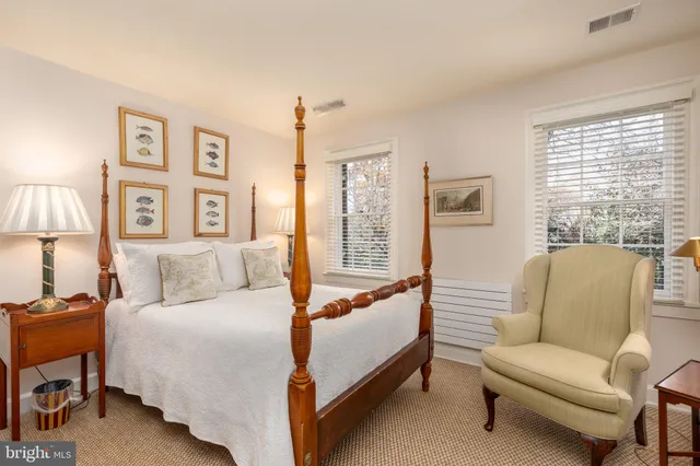 a bed room with a bed and a couch