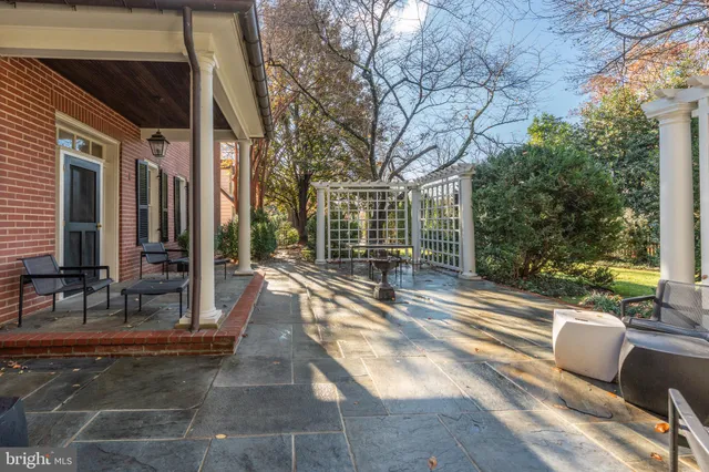 a view of backyard with patio