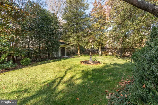 a swimming pool with trees in the background