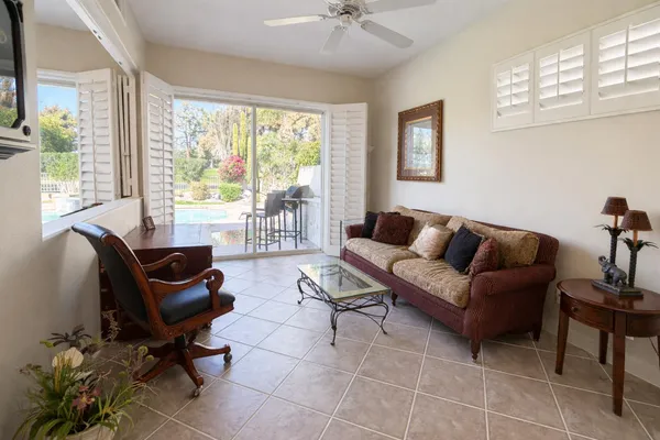 a living room with furniture and a window