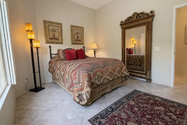 a bedroom with a bed and a dresser