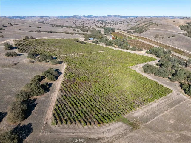 a view of a chairs and table in the balcony