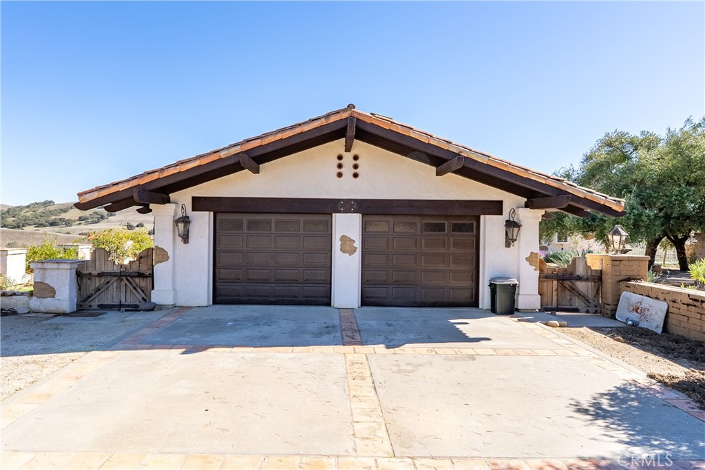 77620 Lowes Canyon Road San Miguel, CA 93451 - Photo 18 of 56 a front view of a house with a garage