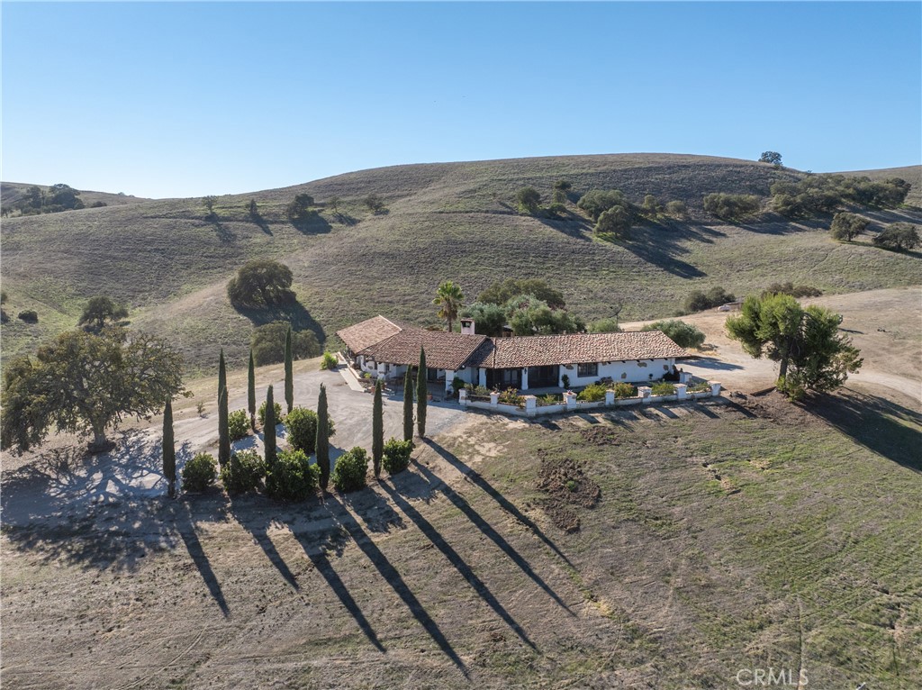 77620 Lowes Canyon Road San Miguel, CA 93451 - Photo 20 of 56 a view of a house with a mountain in the background