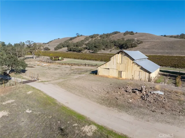 a living room with furniture a dining table and chairs
