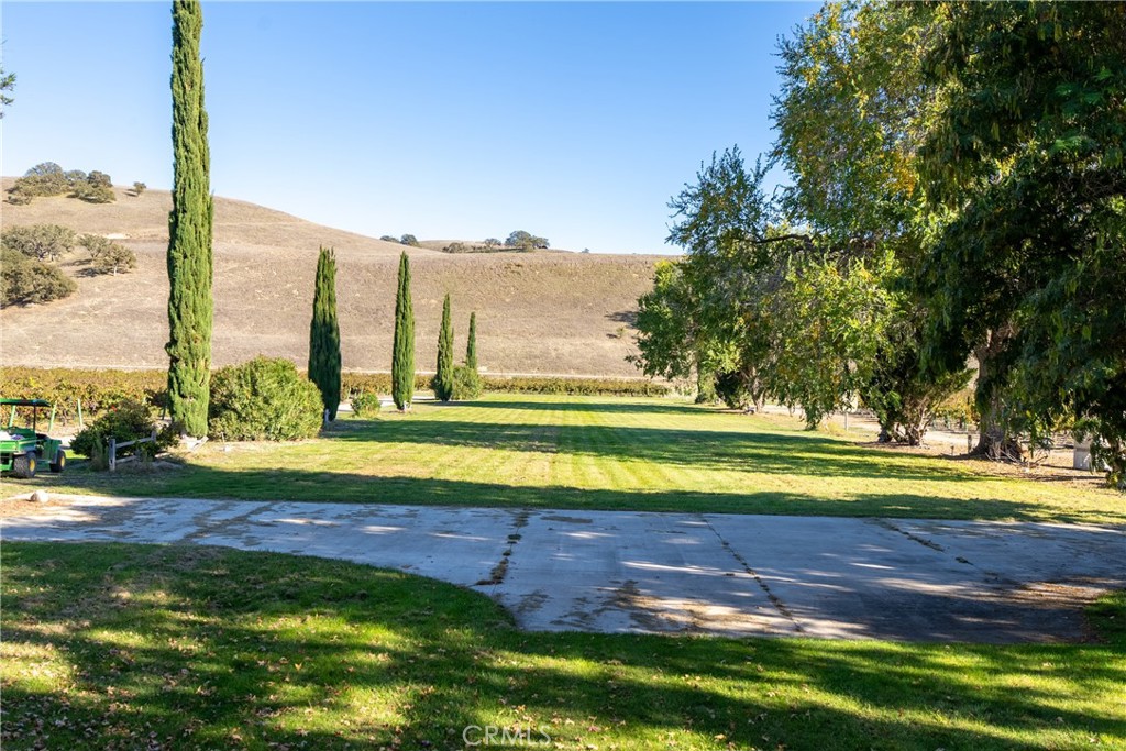77620 Lowes Canyon Road San Miguel, CA 93451 - Photo 37 of 66 a view of a swimming pool with a yard and ocean view