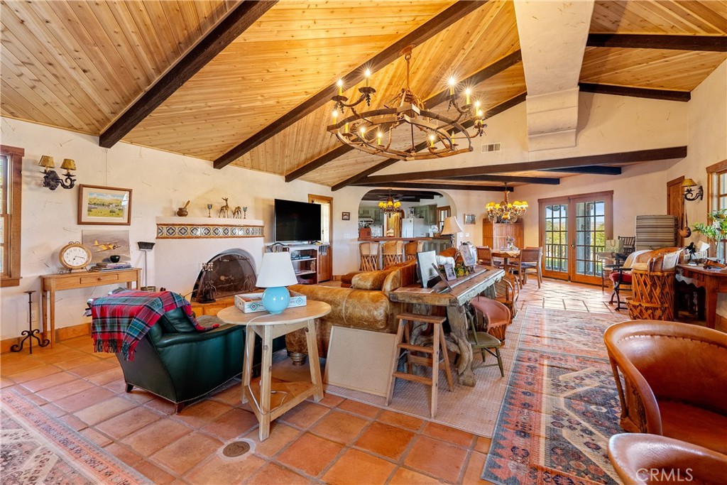 77620 Lowes Canyon Road San Miguel, CA 93451 - Photo 39 of 56 a living room with furniture a dining table and chairs