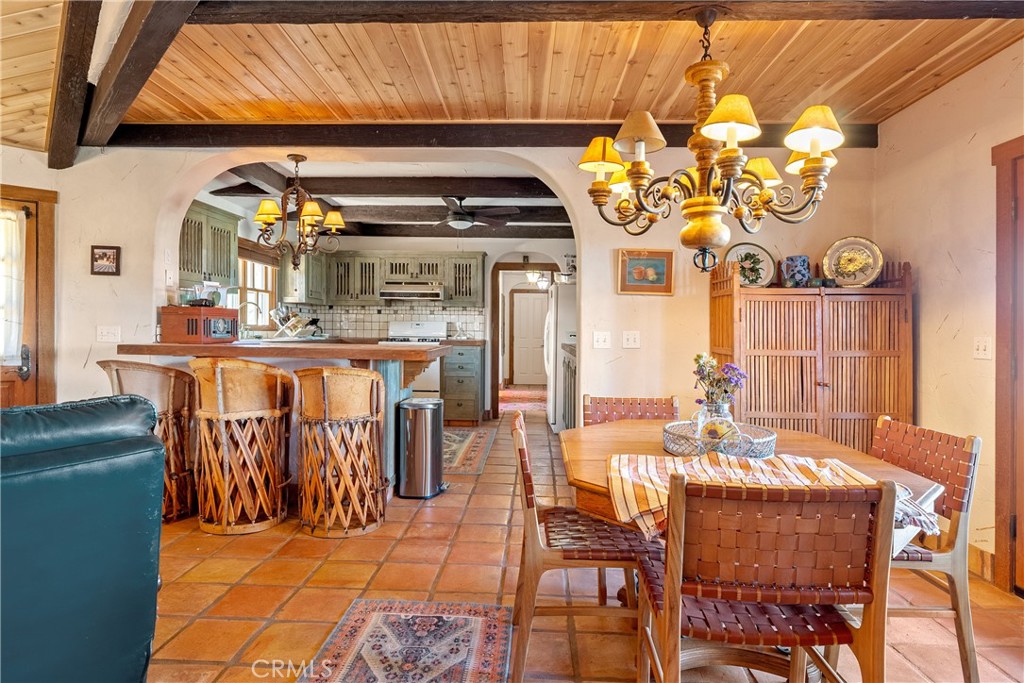 77620 Lowes Canyon Road San Miguel, CA 93451 - Photo 43 of 66 a dining table chairs in a living room