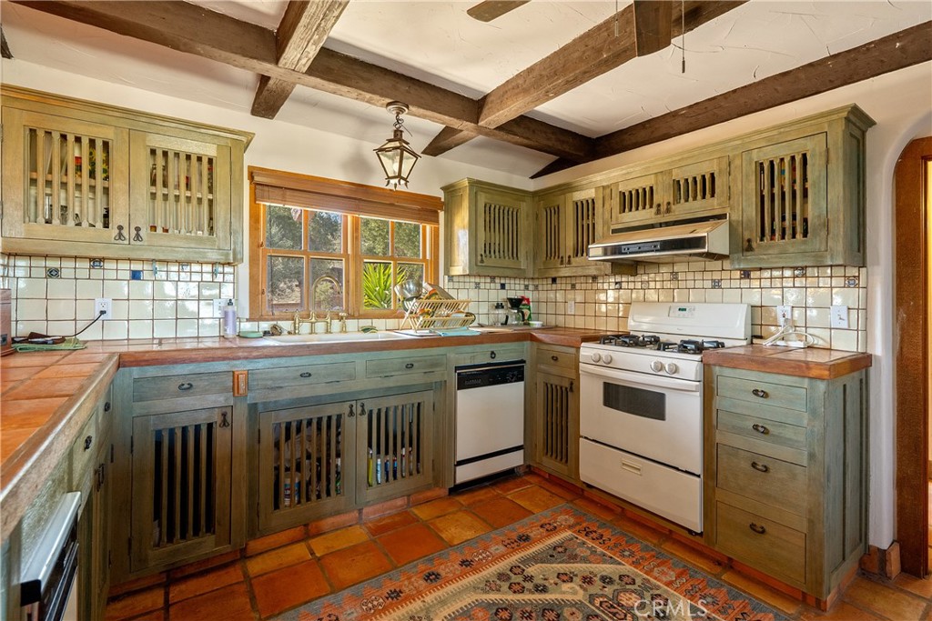77620 Lowes Canyon Road San Miguel, CA 93451 - Photo 44 of 56 a kitchen with a stove a sink and a cabinets