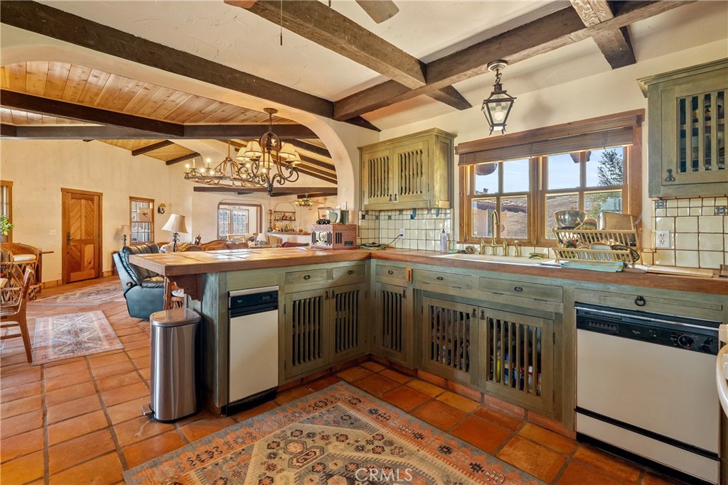 77620 Lowes Canyon Road San Miguel, CA 93451 - Photo 45 of 56 a kitchen with a sink stove and cabinets