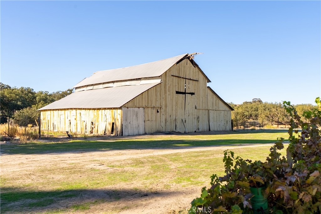 77620 Lowes Canyon Road San Miguel, CA 93451 - Photo 5 of 56 a view of a house next to a lake with a nearby beach