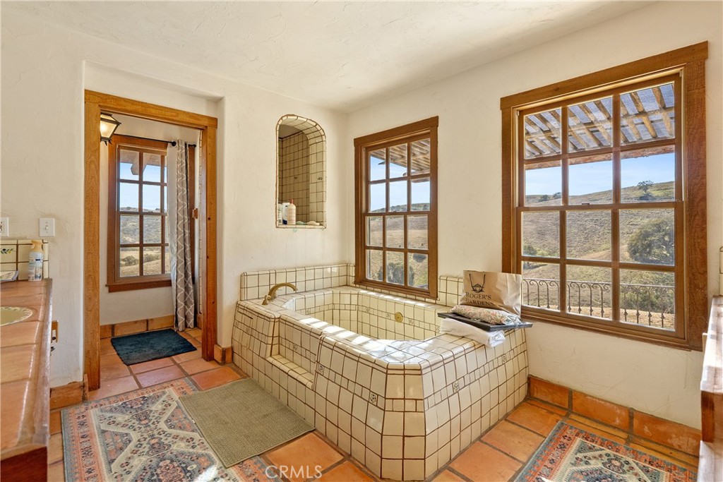 77620 Lowes Canyon Road San Miguel, CA 93451 - Photo 52 of 66 a spacious bedroom with a bed and a window