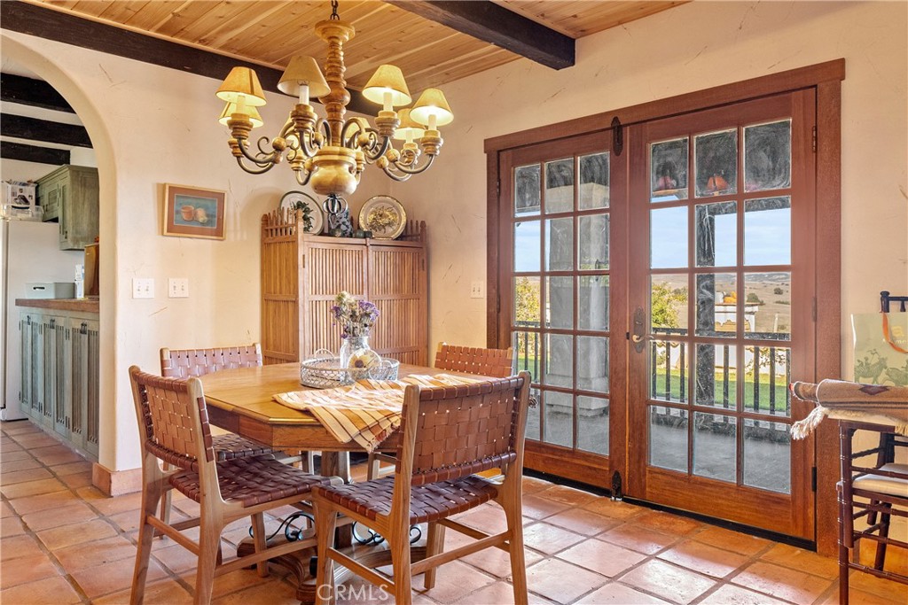 77620 Lowes Canyon Road San Miguel, CA 93451 - Photo 56 of 66 a view of a dining room with furniture a chandelier and a window