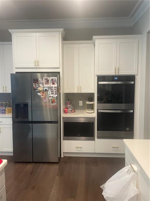 2175 Calverton Lane Southwest Atlanta, GA 30331 - Photo 7 of 11 a kitchen with a refrigerator and a stove