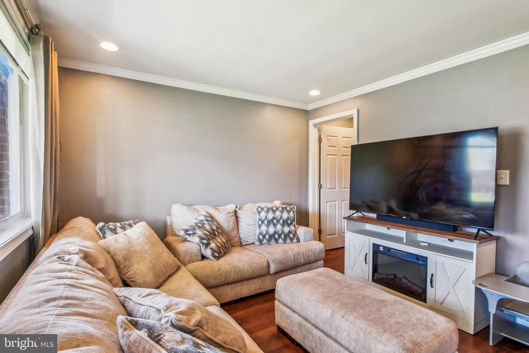 1921 Inverton Road Dundalk, MD 21222 - Photo 7 of 36 a living room with furniture and a flat screen tv