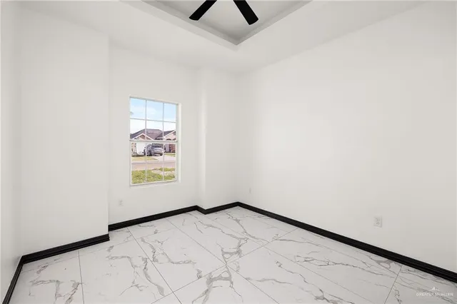 an empty room with a empty space and a window