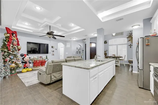 a bedroom with a bed and a lamp on the dresser