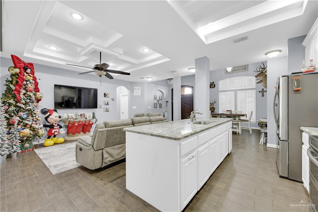 107 Nazareth Street Rio Grande City, TX 78582 - Photo 13 of 26 a living room with furniture and a flat screen tv