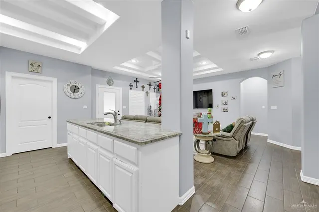 a en suite bathroom with sink and mirror