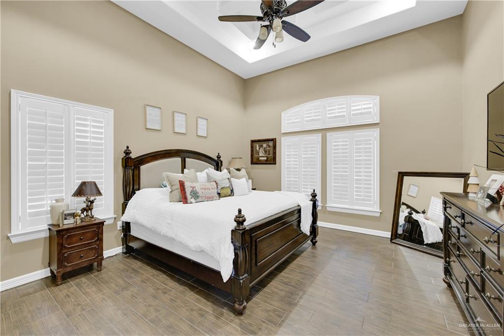 107 Nazareth Street Rio Grande City, TX 78582 - Photo 17 of 26 a bedroom with a bed and a ceiling fan