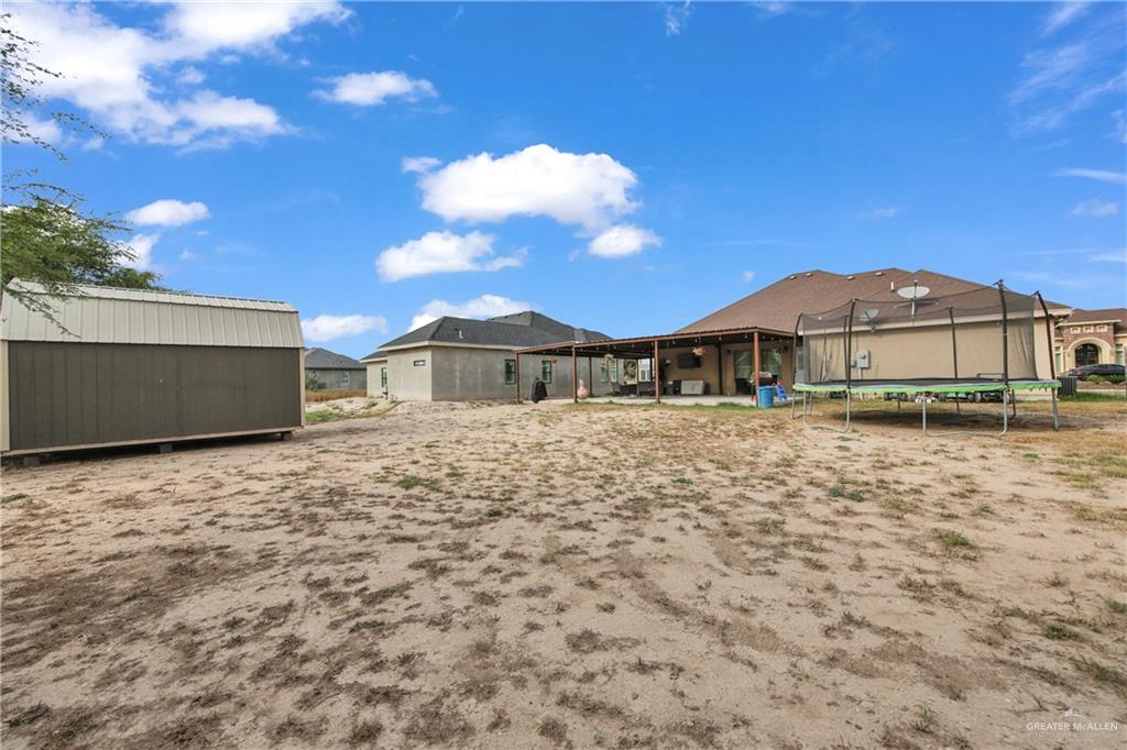 107 Nazareth Street Rio Grande City, TX 78582 - Photo 24 of 26 a front view of a house with a yard
