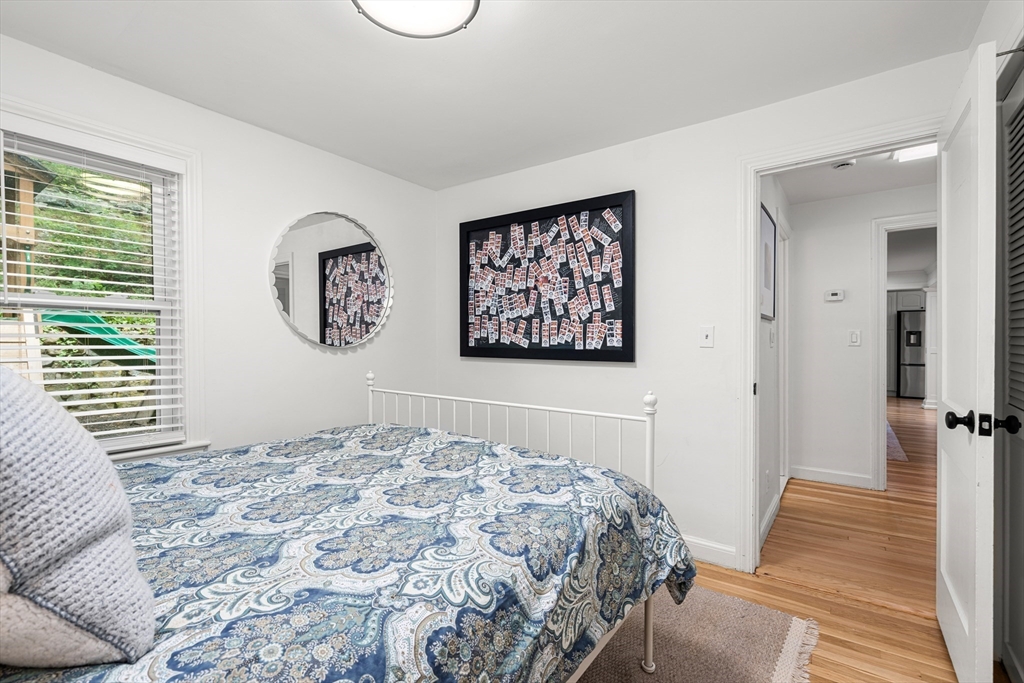 145 Pond Brook Road Newton, MA 02467 - Photo 18 of 39 a bedroom with a large bed and a window