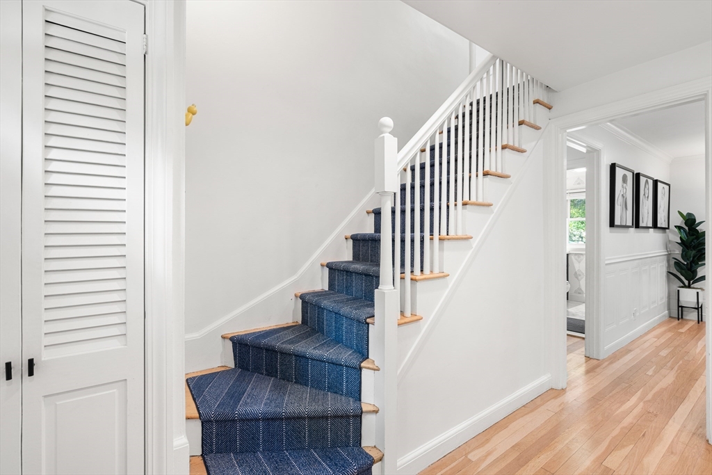 145 Pond Brook Road Newton, MA 02467 - Photo 22 of 39 a view of entryway and hall with wooden floor