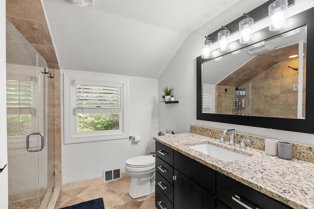 145 Pond Brook Road Newton, MA 02467 - Photo 25 of 39 a bathroom with a granite countertop sink a toilet and a large mirror